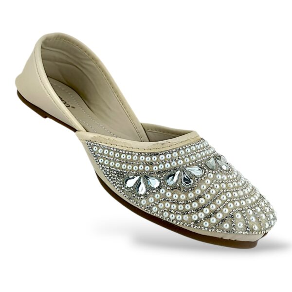 Women's flat juttis wholesale featuring intricate pearl and rhinestone floral embellishments on a classic ethnic flat shoe.