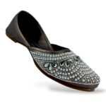 Women's flat juttis wholesale featuring intricate pearl and rhinestone floral embellishments on a classic ethnic flat shoe.