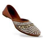 Women's flat juttis wholesale featuring intricate pearl and rhinestone floral embellishments on a classic ethnic flat shoe.