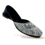 Traditional women's flat juttis wholesale with intricate pearl embellishments and detailed beadwork on the upper.