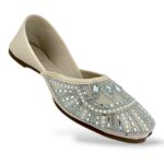 Traditional women's flat juttis wholesale with intricate pearl embellishments and detailed beadwork on the upper.
