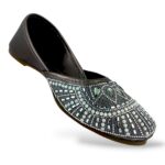 Traditional women's flat juttis wholesale with intricate pearl embellishments and detailed beadwork on the upper.