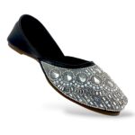 Traditional ethnic footwear featuring women's flat juttis wholesale with detailed rhinestone and bead embellishments.