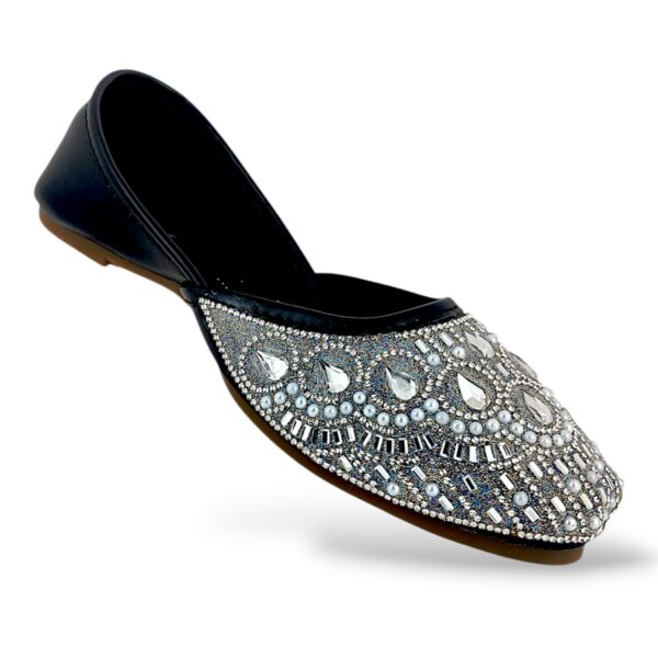 Traditional ethnic footwear featuring women's flat juttis wholesale with detailed rhinestone and bead embellishments.