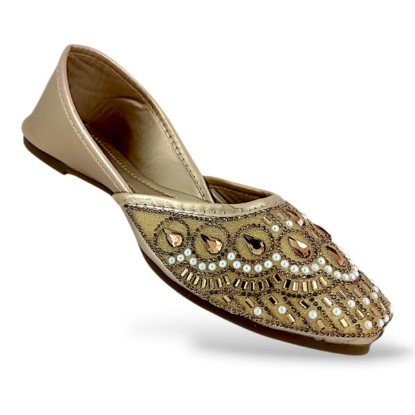 Traditional ethnic footwear featuring women's flat juttis wholesale with detailed rhinestone and bead embellishments.