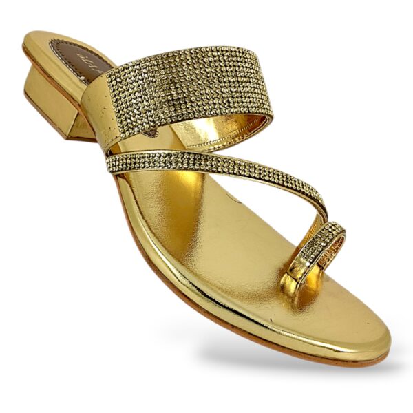 Women's flat sandals wholesale with a toe-ring strap and shiny embellishments.