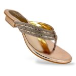 Women's flat sandals wholesale featuring a metallic finish sole and a rhinestone embellished strap.