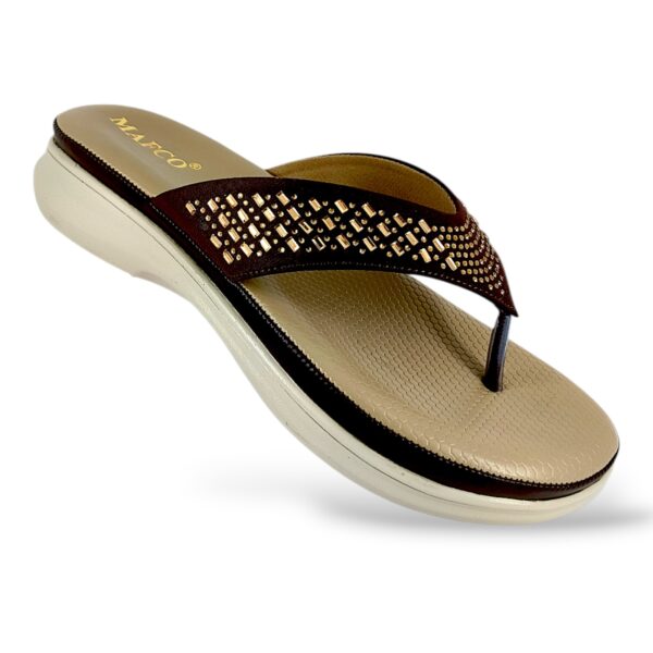 Comfortable women's flat sandals wholesale featuring an embellished V-strap and a textured, cushioned footbed.